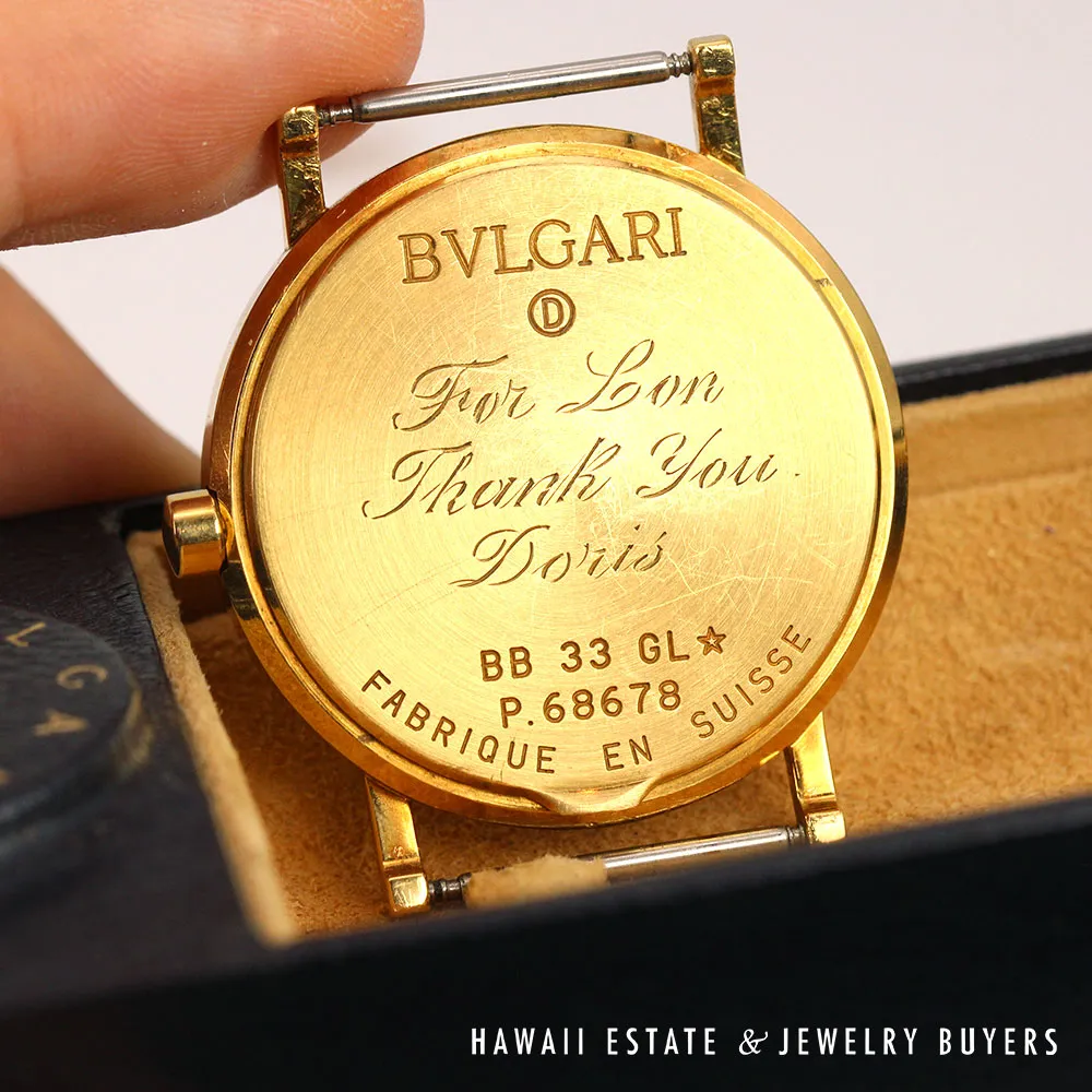 Close-up of the watch's engraved case back and manufacturer markings.