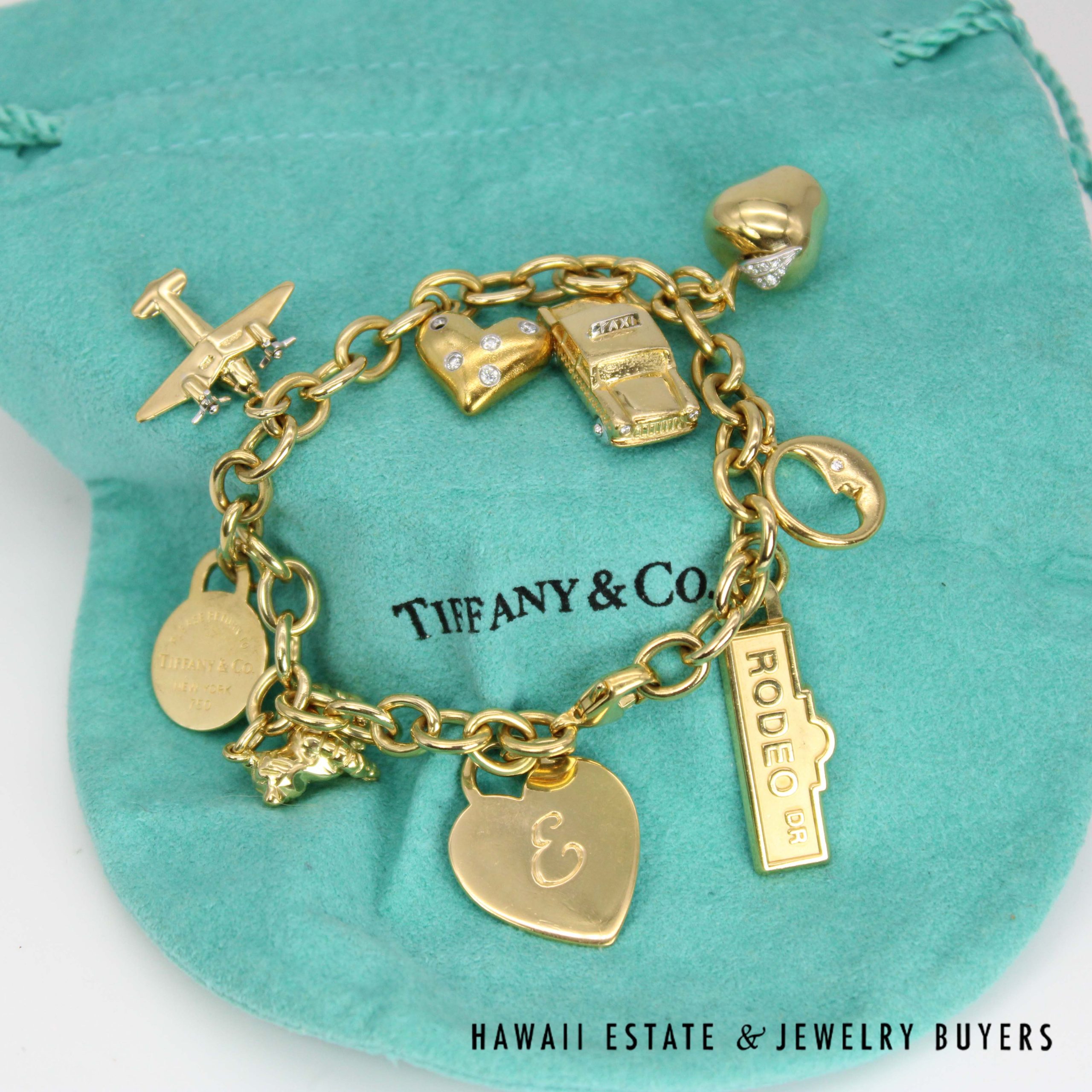 Tiffany & Co. Nine Charm Bracelet 18k Yellow Gold Size 6.75 with