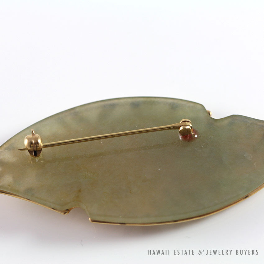 Close reverse view of the jadeite plaque and pin fitting.