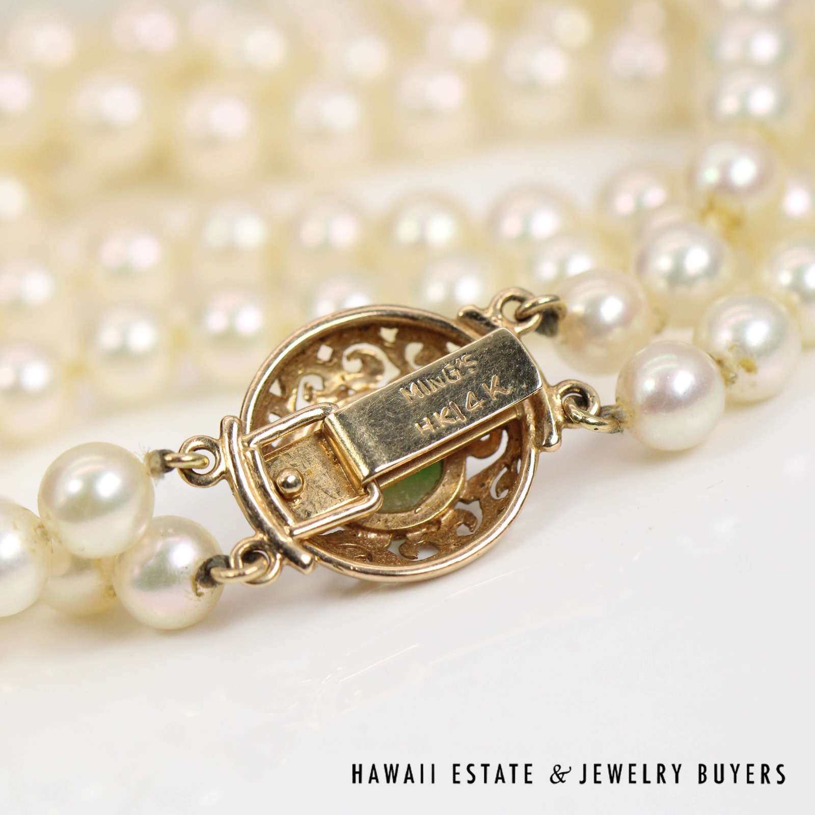 Reverse of the round clasp showing its stamped fastening plate.