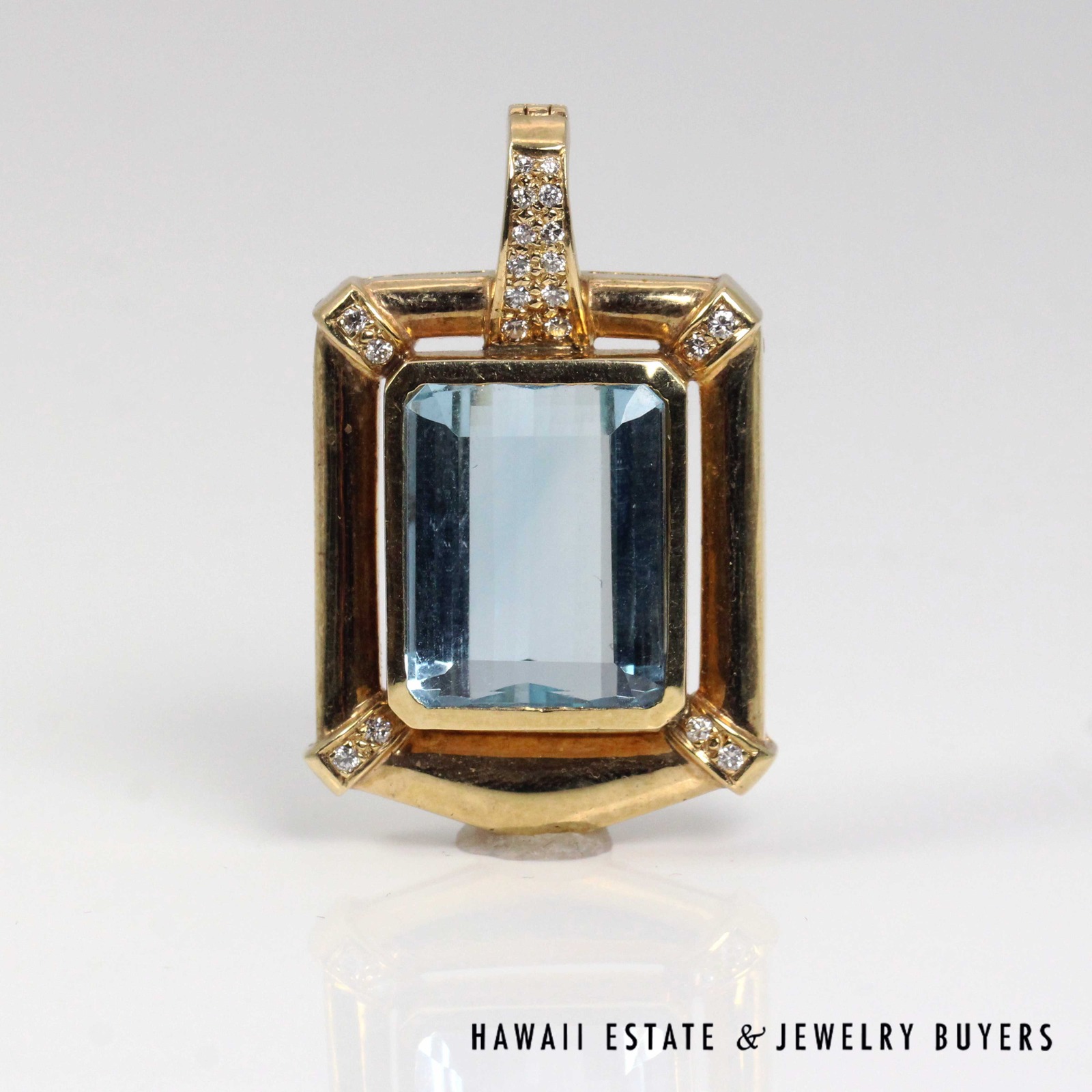 Front view of the rectangular sky blue topaz and diamond enhancer pendant.