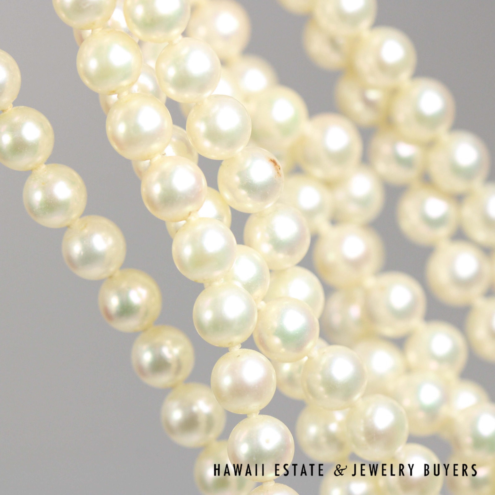 Close view of the rounded pearls in the two strands.