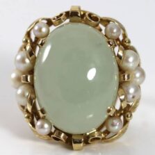 Ming's Hawaii pale green oval jade and pearl ring, front view