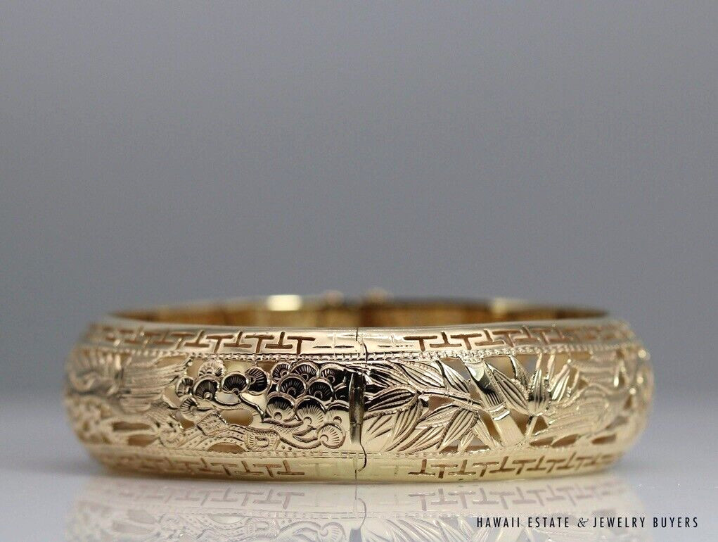 Closed bangle showing the hinge seam between the crane and bamboo sections.