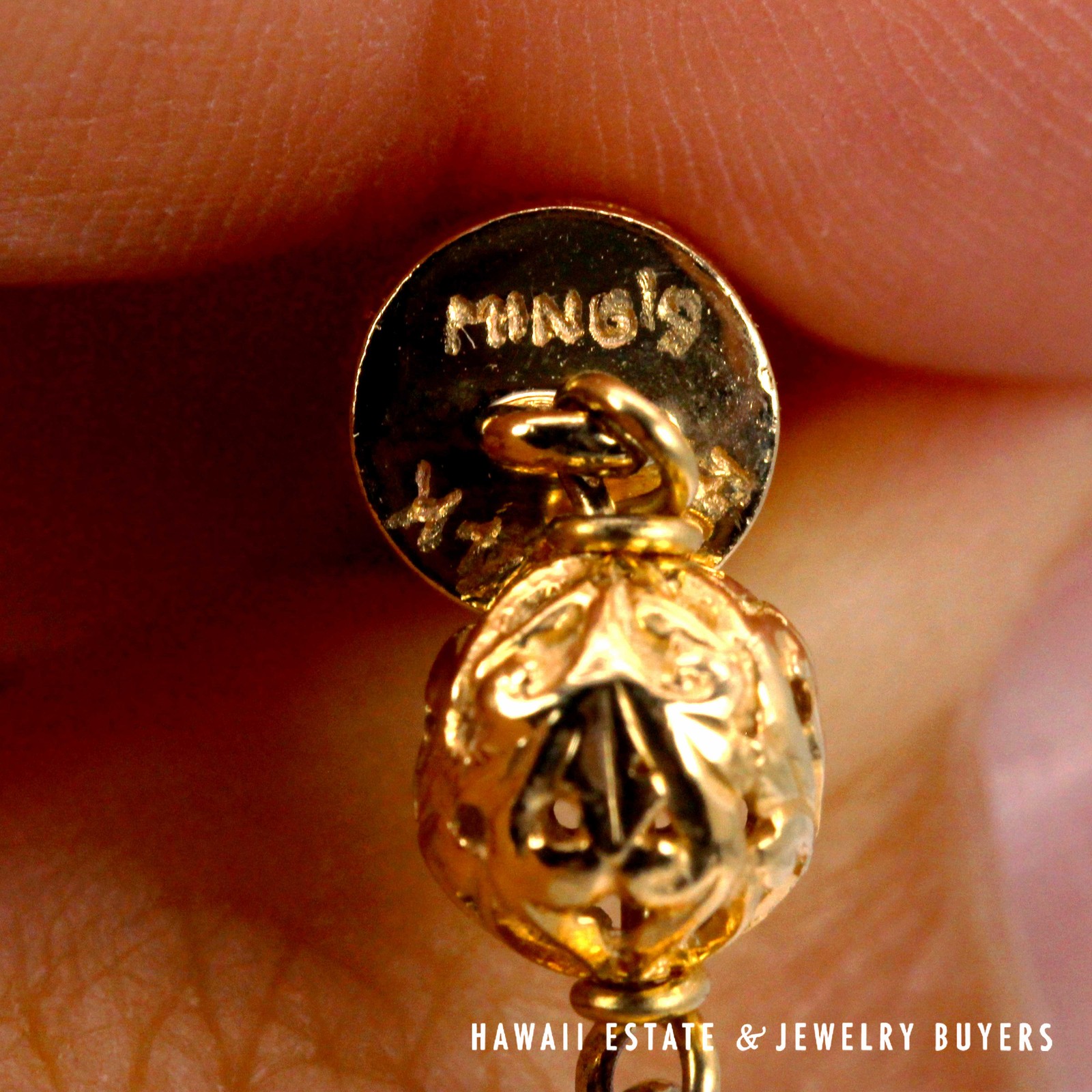 Close-up of the Ming's and 14K marks on a bead end.