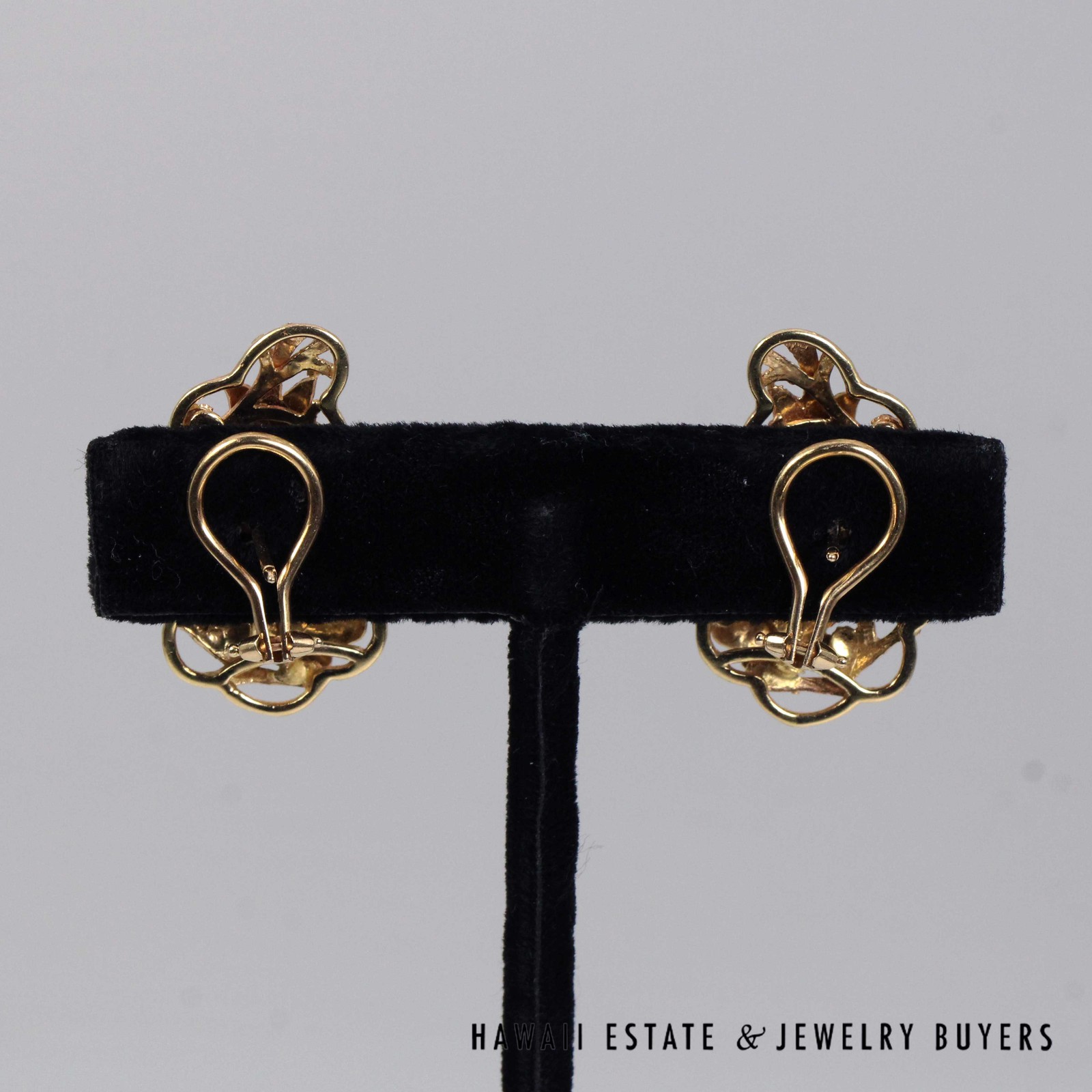 Rear view of the Bird in Plum earrings showing pierced posts and loop-shaped clip backs.