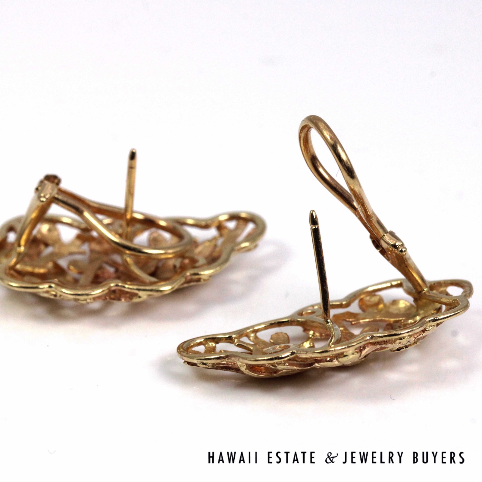 Bird in Plum earrings face down with pierced posts and clip backs open.